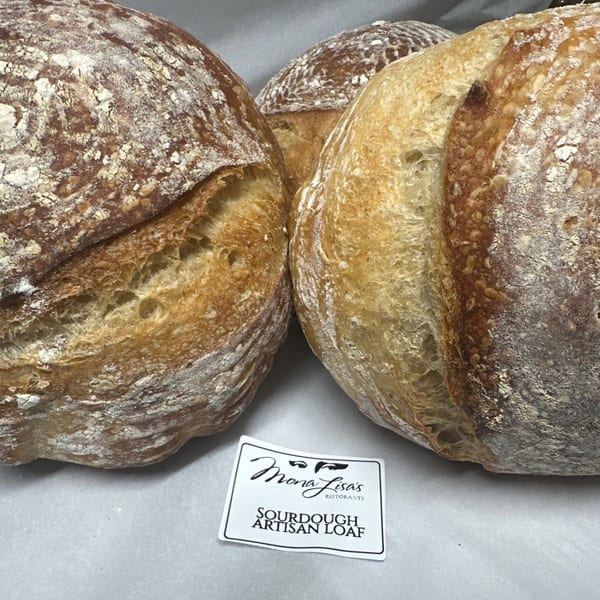 Three Mona Lisa's Ristorante sourdough artisan loaves with a branded label in the foreground.